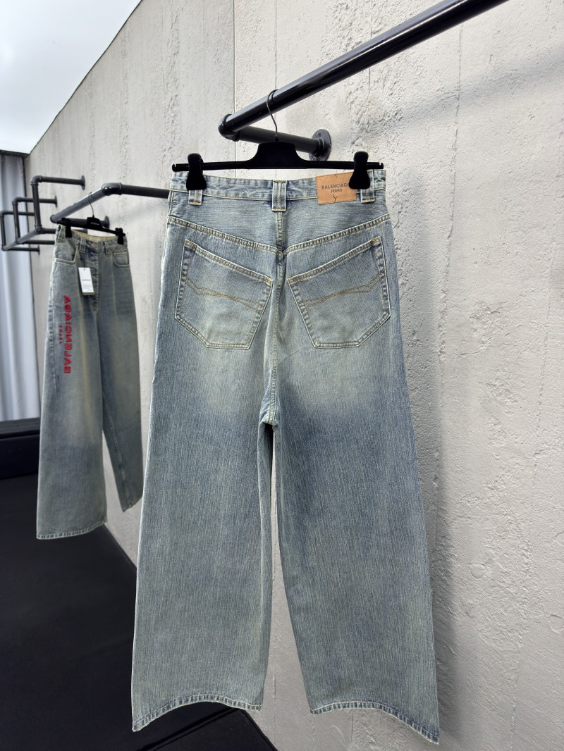 Balenciaga embroidered denim pants with red lettering 1