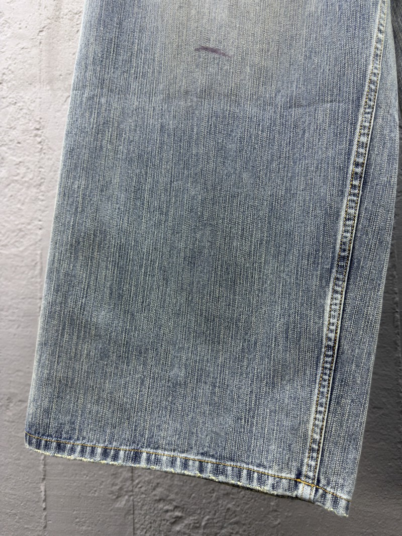 Balenciaga embroidered denim pants with red lettering 5